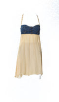 Beige dress with denim corset top on a white background